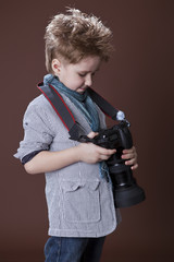 child in studio with professional camera