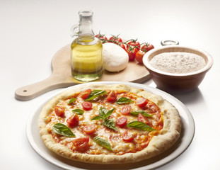 still life with pizza and ingredients