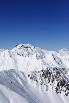 Winter mountains and blue sky. Caucasus Mountains, Georgia.