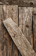 Obraz premium Old wooden nailed boards close-up as background