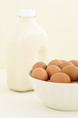 Fototapeta na wymiar fresh eggs and half gallon milk