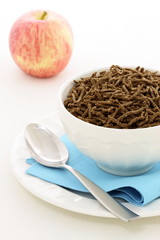 healthy breakfast  with fresh apple and wheat bran cereal