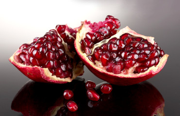 ripe pomegranate fruit on grey background