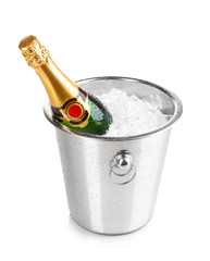 Bottle of champagne in bucket isolated on white