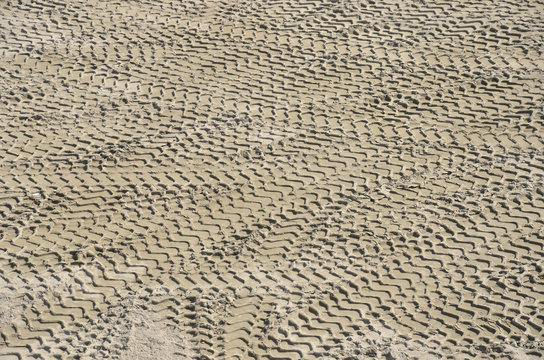 Tires prints on sandy ground