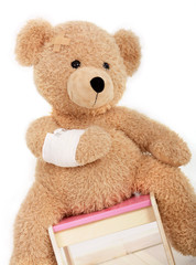 Teddyb&auml;r mit einem Armverband