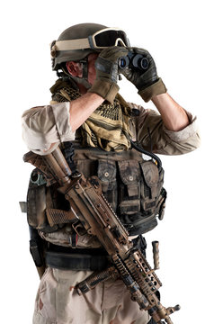 Soldier with binoculars against white background.