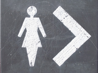 Women's toilet sign.