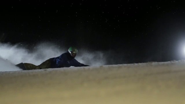 Snowboarding in night. Slow motion. 