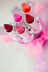 makeup and cosmetics: lipsticks and lipglosses with bow
