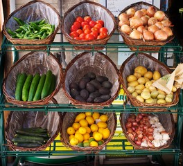 Vegetables in baskets on market place.