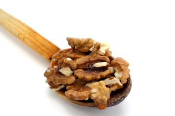wooden spoon with walnuts