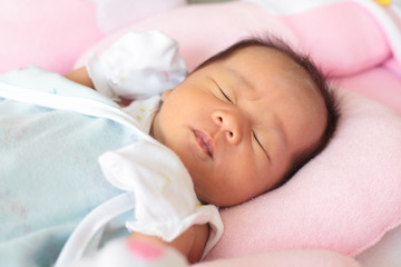 Fototapeta na wymiar infant sleep on baby bed
