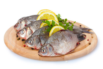 Fresh fishes with lemon, parsley and spice