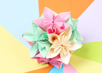 Colorfull origami kusudama on bright paper background