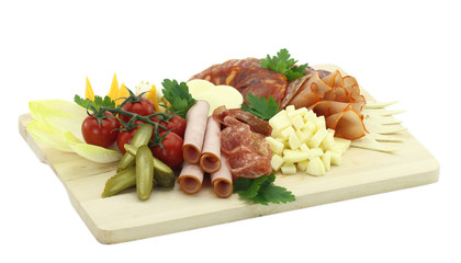 Meat delicatessen plate with cheese