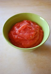 Jelly with strawberries in a green bowl