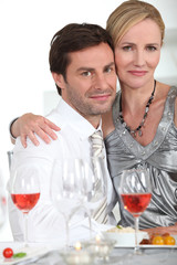 Couple having dinner with rose wine