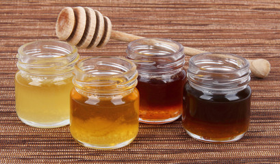 jars full of honey wooden stick, mix taste - 40770331