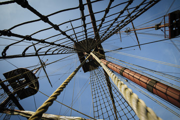 Fototapeta premium Three masts on tall merchant ship with ropes and ladders