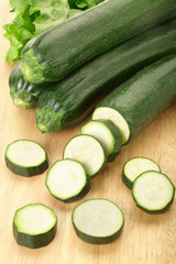 Zucchini or courgette sliced on cutting board