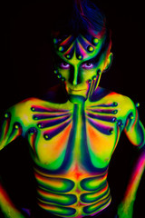 Man with fluorescent bodyart