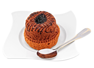 cupcake on white plate, isolated on white with spoon on the side