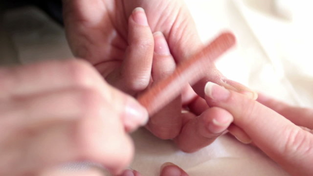 Hand holding an emery board