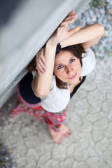 Brunette against wall