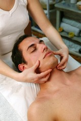 Obraz na płótnie Canvas Man receiving face massage