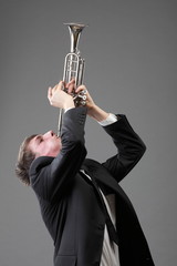 Portrait of a young man playing his Trumpet