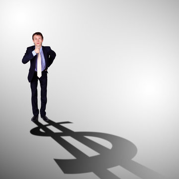 Businessman with shadow as a currency symbol