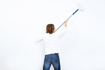 Young man with paint brush