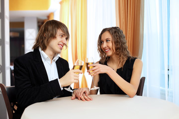 Couple in a restaurant with shampagne