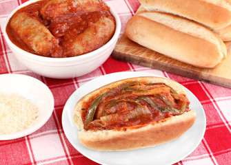 Sausage sub with peppers, onions and tomato sauce.