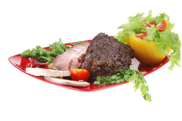 beef on red plate over white