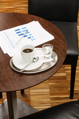 Coffee break business table with reports charts