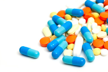 colorful pills on white background