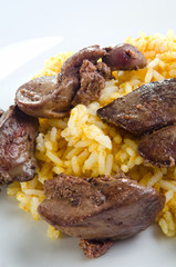 chicken liver with onion slices on a plate