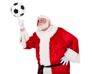 Weihnachtsmann balanciert Fußball auf Finger