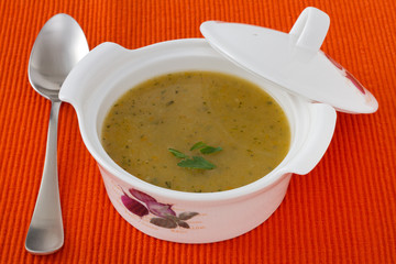vegetable soup in the bowl and spoon