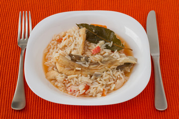 rice with fish on the white plate