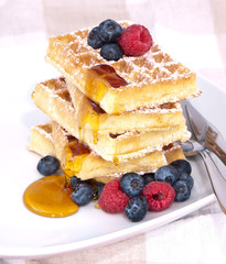 Fresh waffles with fruits and sirup