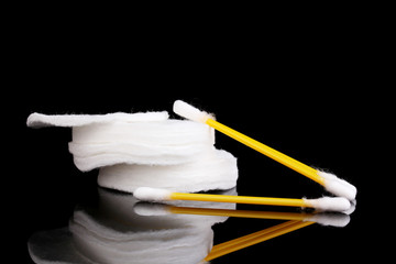 Cotton swabs and sticks isolated on black