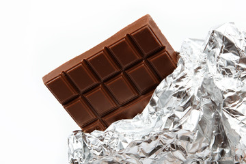Chocolate bar in foil isolated on white background