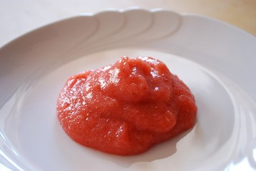 Jelly with fresh strawberries on a white dish