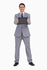 Man in a suit showing a tactile tablet screen