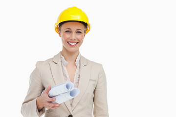 Portrait of a woman architect holding plans