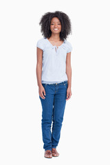 Obraz premium Young woman standing upright while showing a great smile