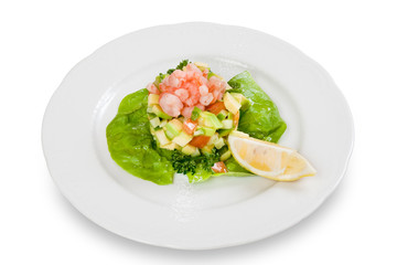 Salad with shrimp and avocado on plate isolated on white